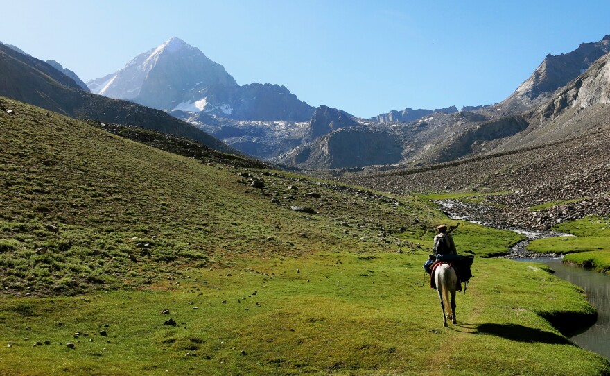 A Panjshiri guide rides through one of the valleys leading to Mir Samir, one of Afghanistan's most challenging peaks, near which the Afghan women and girls set up base camp for their climbing expedition.