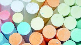 Colorful sticks of sidewalk chalk. 