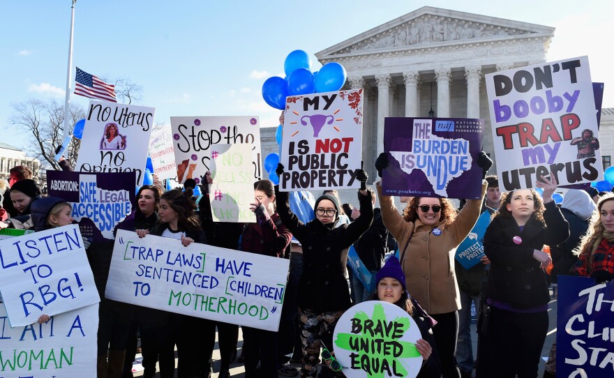 Supporters of abortion rights rallied Wednesday outside the U.S. Supreme Court, where justices heard arguments about a Texas law that imposed health and safety requirements on clinics in the state.