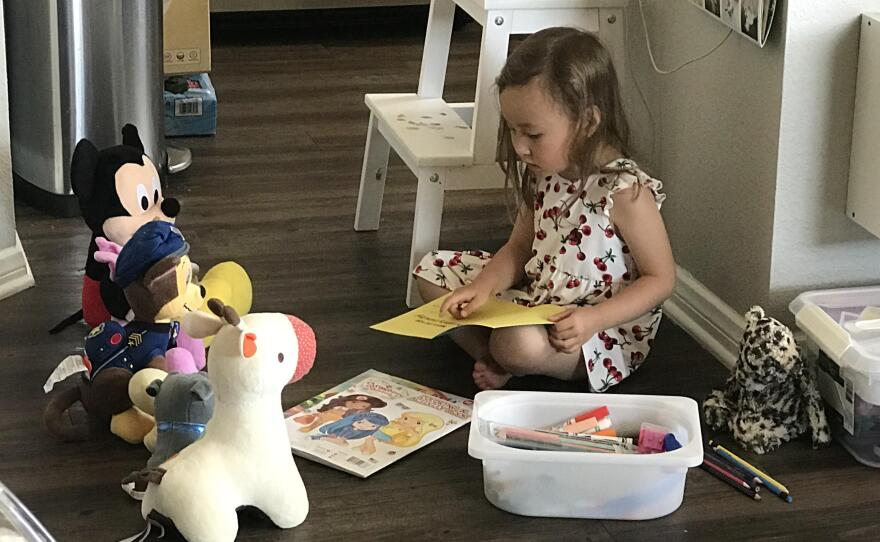 Aaron Jacobson's daughter Amelia plays alone at home in this undated photo.