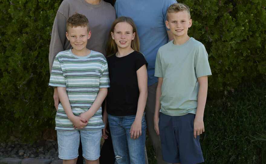 Members of the Hall family pose for a photo at their Las Vegas home: parents Hillary and Jeff and children Winston (from left), Maggie and Walker.