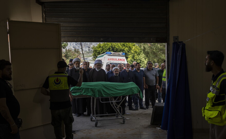Religious leaders pray for a Lebanese civilian recently killed in southern Lebanon in Sidon, Lebanon, on May 13.