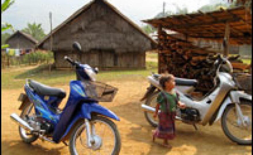 Motorcycles from China — which cost less than half what Thai motorcycles cost — are easing travel for villagers in rural Laos.