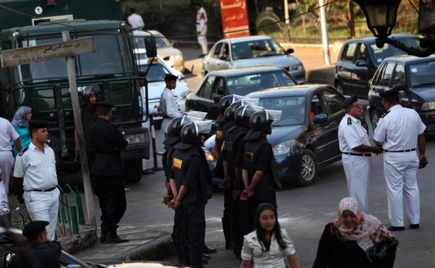 Riot police stand guard in anticipation of a petition drive by the National Association for Change, Mohamed ElBaradei's constitutional reform movement, in Cairo earlier this month. Volunteers canceled the day's petition effort when faced with the overwhelming police presence.