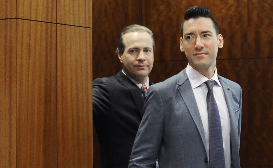 David Robert Daleiden (right) leaves a courtroom after a hearing in Houston. California prosecutors say two anti-abortion rights activists who made undercover videos of themselves trying to buy fetal tissue from Planned Parenthood have been charged with 15 felony counts of invasion of privacy. State Attorney General Xavier Becerra announced the charges Tuesday.