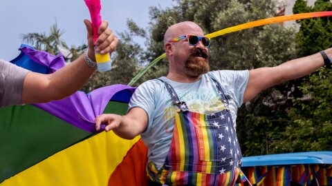 A San Diego Pride Parade attendee celebrates while marching in Hillcrest, July 16, 2022.