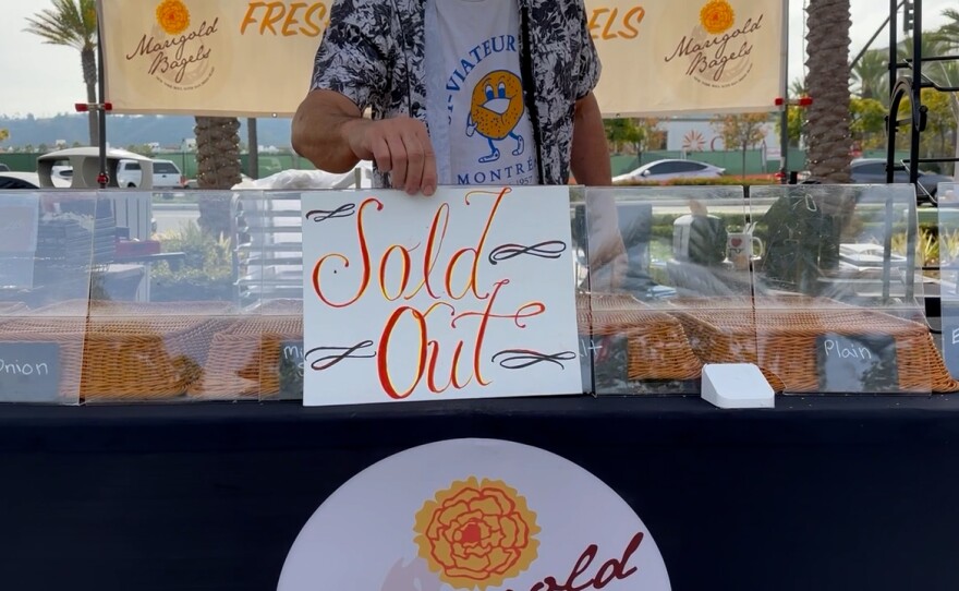 Marigold Bagels' founder and owner Mike Rabinowitz puts out the final sold out sign at Civita Park's farmers market. The popular bagel company will pause selling at the farmers market in order to focus on opening a storefront by this summer. Dec. 29, 2024