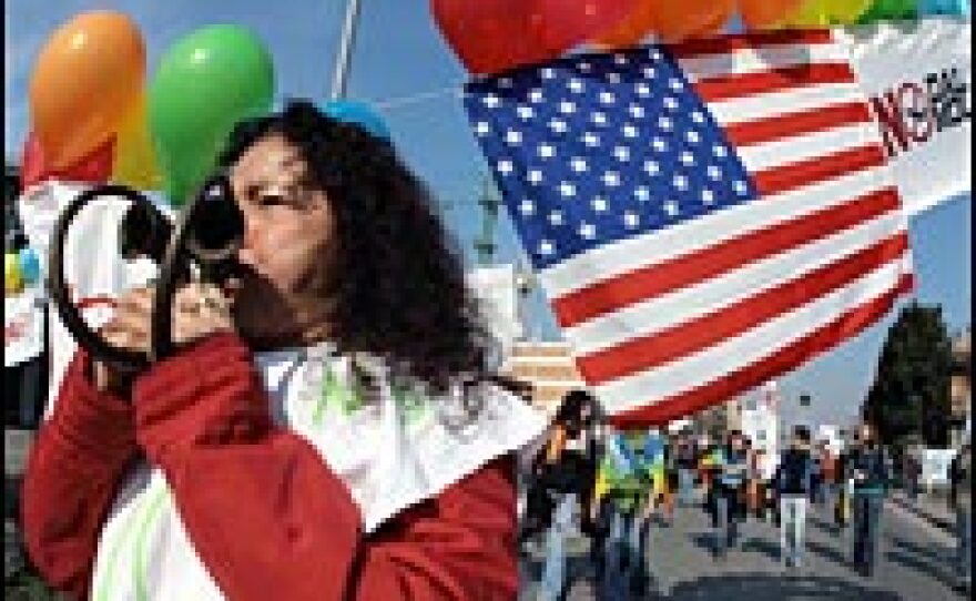 A protester plays trumpet during a demonstration against the planned expansion of the U.S military base near the Dal Molin airport in Vicenza, Feb. 17 2007.