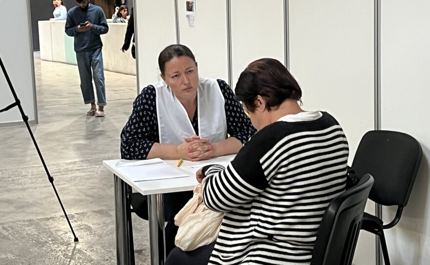 Katarina Sukhomlynova, a member of Ukraine's Mariupol city council and a first responder, volunteers at a refugee center in Poland. She is trying to encourage Ukrainians to give testimony.