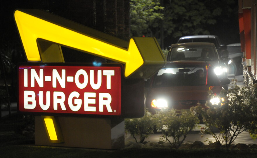 FILE PHOTO: Cars line up in the drive-thru at In-N-Out Burger on Tuesday, June 8, 2010, in Baldwin Park, Calif.