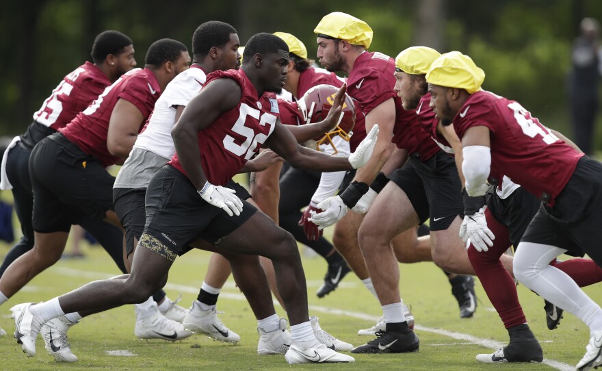 The Washington Football Team during a June practice. The team was one of the last in the league to reach a 50% vaccination threshold among its players.