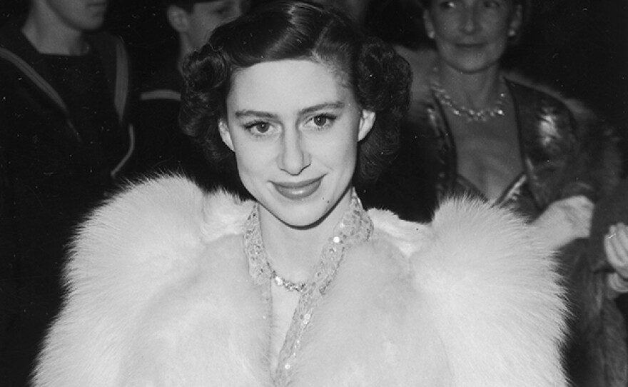 Princess Margaret attending a film premiere in Leicester Square in white fur, London, England, 1951.