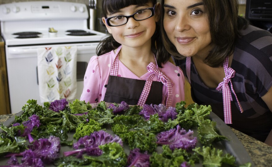 Hannah Robertson, 9, and her mom, blogger Kia Robertson — with the makings for kale chips, of course.