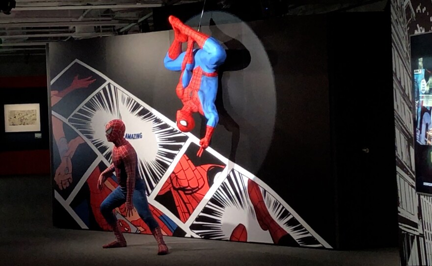 A Spidey cosplayer took advantage of a Spider-Man photo opp at Spider-Man: Beyond Amazing - The Exhibition.