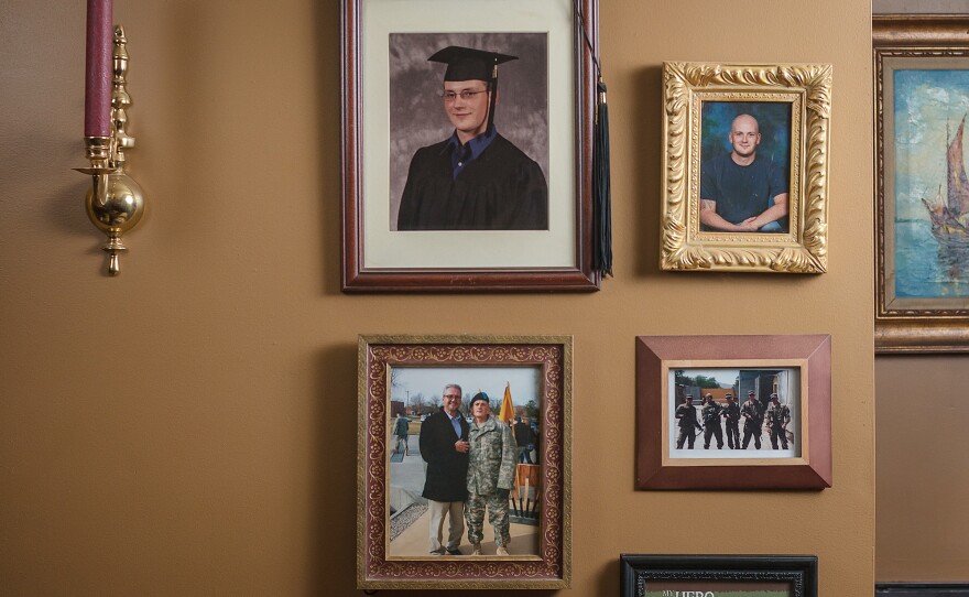Photos of Sgt. Toombs are displayed at his father's home. John was abruptly kicked out of the Murfreesboro VA residential drug program for being late to take his medication in 2016.