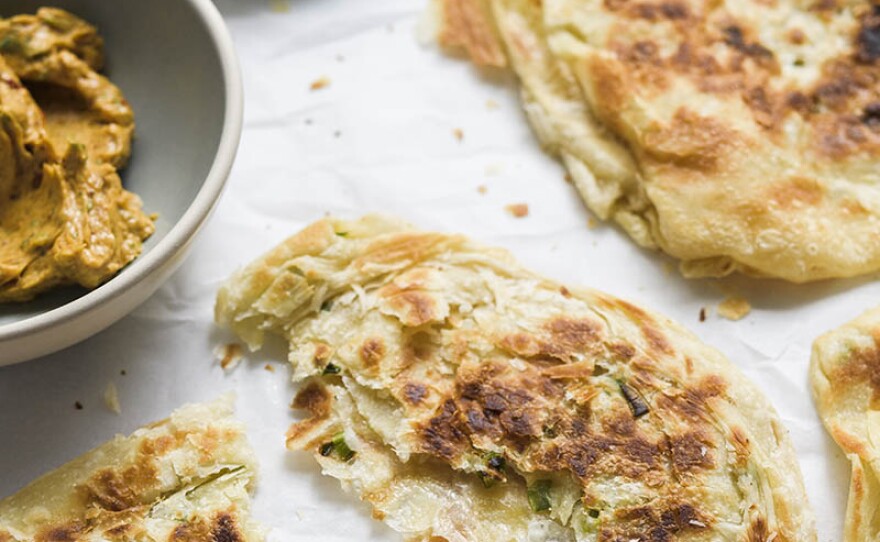 In this episode, host Chris Kimball travels to Taipei, Taiwan, where he meets Qin Jia Bing Dian, who teaches him her secret to making the flakiest scallion pancakes. 