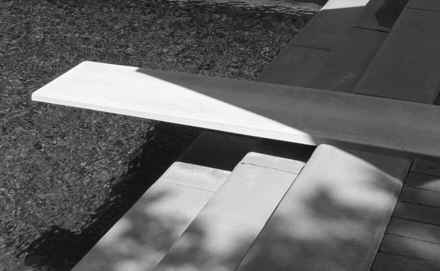 The swimming pool and diving board in the backyard of a home built for comedian Leon Errol in 1940 in LA's Toluca Lake neighborhood. The next owner was actor William Holden, who hosted the wedding reception for Ronald and Nancy Reagan there in 1952. Denzel Washington eventually lived in this home, though he has since relocated.