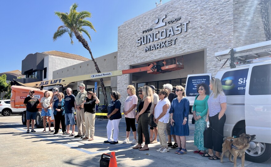 Community members and co-owners gather outside of SunCoast Market Co-op in Imperial Beach, July 31, 2025.