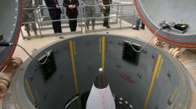 Defense Secretary Robert Gates (center) and other officials inspect missiles housed underground at Fort Greely in Alaska on June 1. The missile defense system in the works in Alaska is similar to the plan that the Bush administration had proposed for Europe — which President Obama reversed on Thursday.