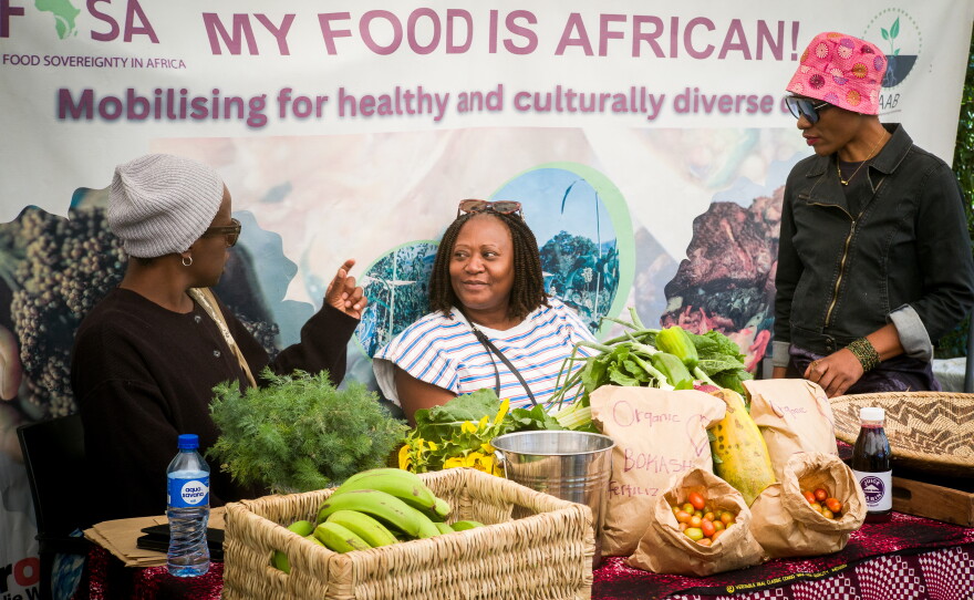 At a market in Zambia, organic vegetables share table space with bags of homemade bokashi fertilizer that sell for about $2.50 each.