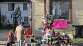 Mourners, including María Guadalupe Rodríguez (kneeling), pray and pay their respects in front of a makeshift memorial for Lorenzo Salgado Araujo, a Mexican immigrant shot and killed by immigration agents in Houston.