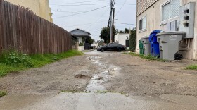 Puddles form in a North Park alley on Dec. 31, 2025.