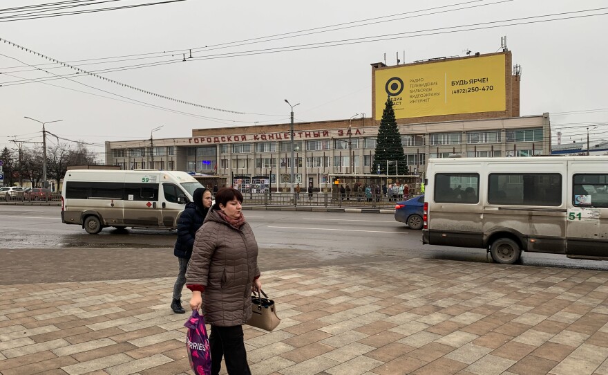 Pedestrians in Tula pass a concert hall. The gritty industrial town 100 miles south of Moscow has been a center of the Russian arms industry for 300 years.