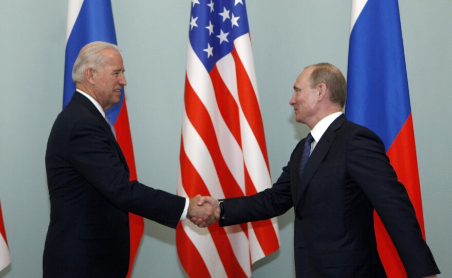 Putin, then Russia's prime minister, greets Biden, then vice president, in Moscow in March 2011. Biden has said he once told Putin he looked into his eyes and didn't see a soul.