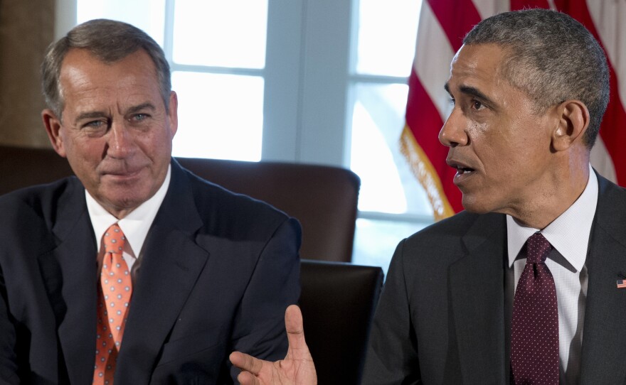 House Speaker John Boehner listens as President Obama speaks to media during a bipartisan, bicameral leadership meeting at the White House this week. Boehner and others have reacted dismissively to Obama's tax overhaul plan.