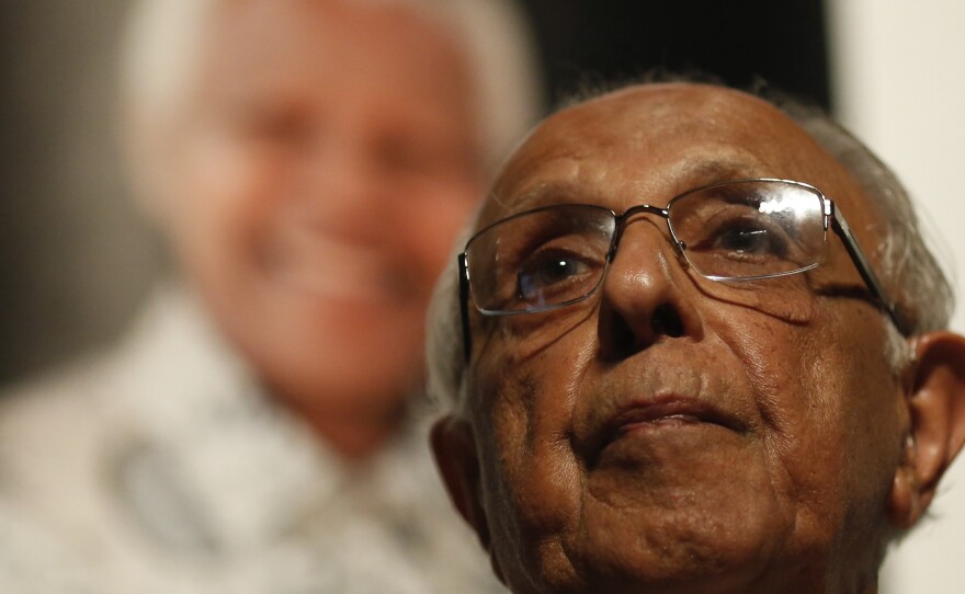 Anti-apartheid activist Ahmed "Kathy" Kathrada talks during a tribute to his close friend and former South African President Nelson Mandela at Gandhi Hall on Dec. 8, 2013, in Johannesburg. Kathrada died on Tuesday at 87.