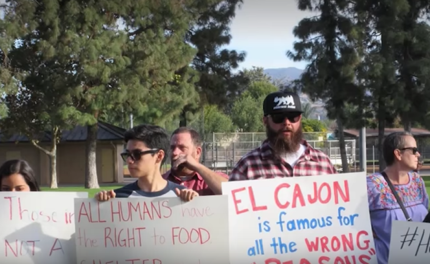 Demonstrators protest El Cajon's city ordinance banning people from feeding the homeless in public spaces, Nov. 24, 2017. 