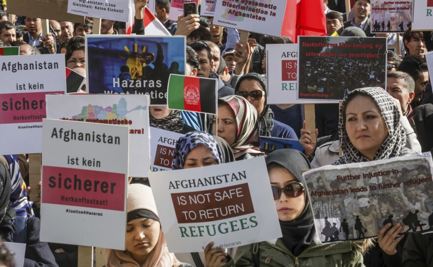 People who belong to Afghanistan's Hazara minority demonstrate outside the venue of a conference on Afghanistan in Brussels on Wednesday.