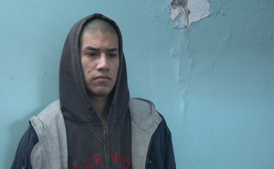 A resident of the Tijuana rehabilitation center DAR stands against the wall, May 1, 2015.