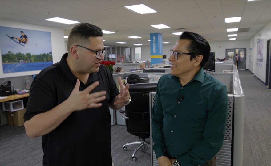 Jorge Meraz talks with Eduardo Salcedo, the site director of Mexican operations of Össur prosthetic limb factory.