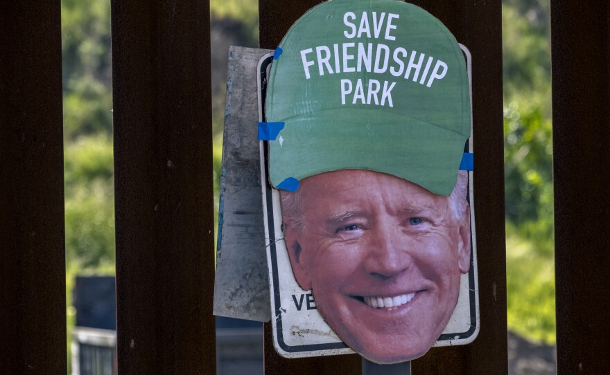 Friends of Friendship Park activists placed a cardboard cutout of President Joe Biden’s head wearing a green ball cap with the words “Save Friendship Park” onto the border wall, Feb. 20, 2023.