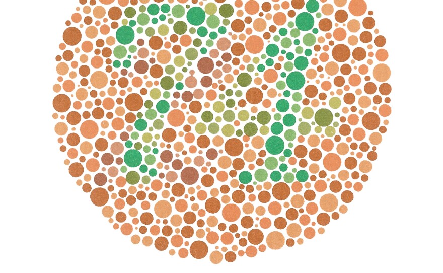 Viewers with normal color vision read the number in this circle as 74. Those with red-green deficiencies see the number 21. Those with total colorblindness don't see a number at all.