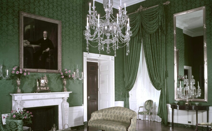 Paintings of past presidents adorn the walls as a crystal chandelier hangs from the ceiling of the Green Room on Jan. 21, 1963.