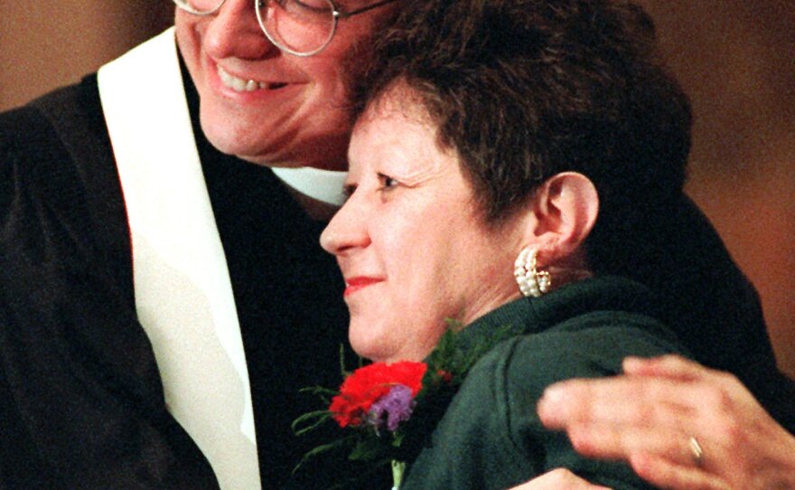 Norma McCorvey, the "Jane Roe" of the 1973 decision, embraces the Rev. Robert L. Schenck of the National Clergy Council before she addresses a memorial service at Georgetown University in Washington, D.C., on Jan. 21, 1996. A year earlier McCorvey shocked abortion-rights advocates by becoming a spokeswoman for the other side of the debate, stating she no longer supported abortion rights.