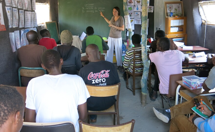 Migrants from Africa receive instruction in French in the port city of Calais. Some 3,000 migrants live in a makeshift camp known as "The Jungle." Most are seeking to travel on to Britain, while some are seeking asylum in France.