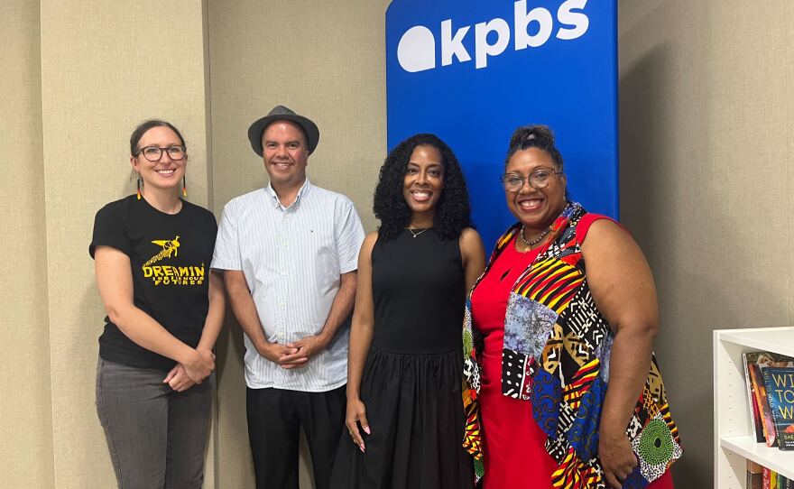 Katie Walkiewicz (left) and Chag Lowry, co-organizers of the inaugural Indigi-Con, stand next to KPBS Midday Edition host Jade Hindmon and Afrofuturism Lounge organizer LaWana Richmond (right) in the Midday Edition studio, July 22, 2025.