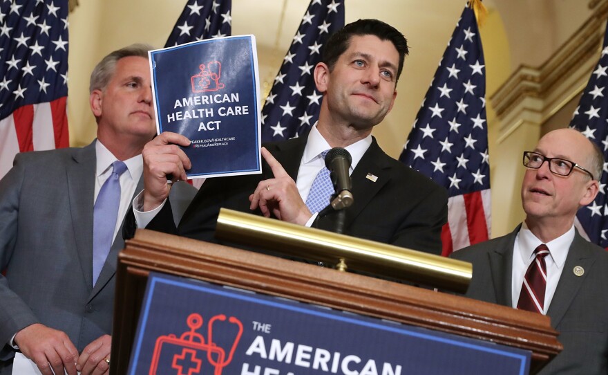Speaker of the House Paul Ryan holds up a copy of the American Health Care Act during a March 7 news conference with House Majority Leader Kevin McCarthy, R-Calif. (left), and House Energy and Commerce Committee Chairman Greg Walden, R-Ore., outside Ryan's office in the Capitol.