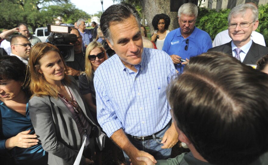 Republican presidential candidate Mitt Romney meets with supporters during the grand opening of his Florida campaign headquarters in Tampa on Friday.