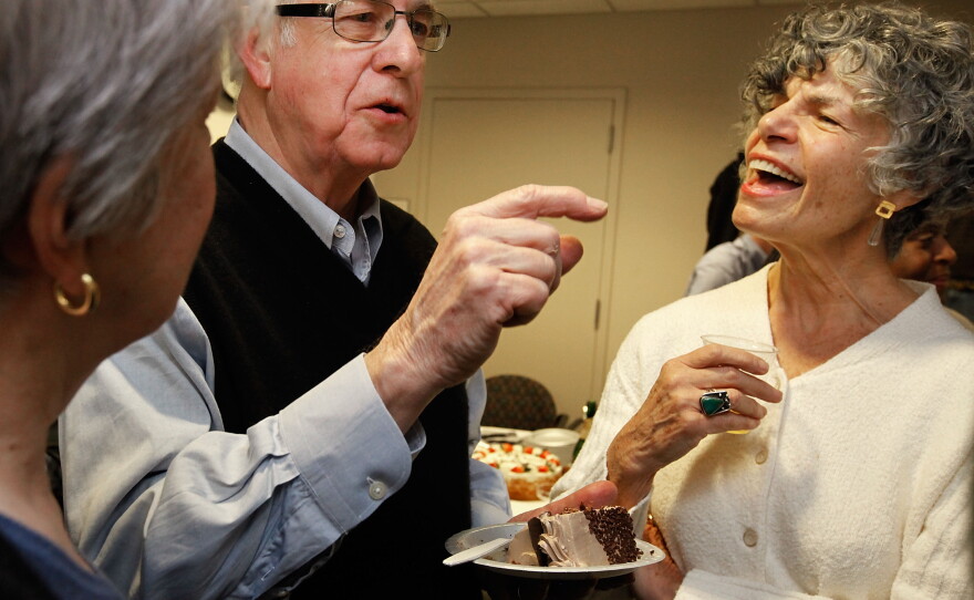 Carl Kasell talks with Susan Stamberg (right) and Linda Wertheimer after delivering his last newscast at NPR on Dec. 30, 2009 in Washington, D.C.