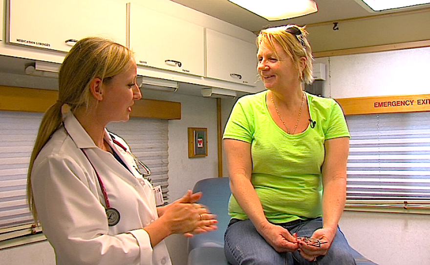 Nurse practitioner Summer Tekippe talks with patient Sherry Manning inside Family Health Center's mobile medical unit.
The mobile units go to communities that lack brick and mortar clinics.