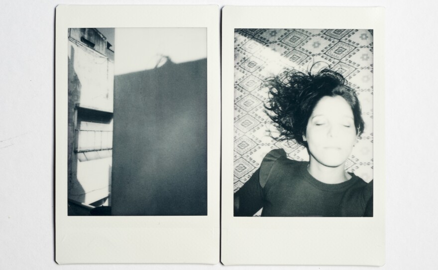 (Left) Alonso lives in a small but comfortable apartment. She has everything she needs. View from the living room window, where she sees shadows from one building to the next. (Right) Self-portrait in her room.