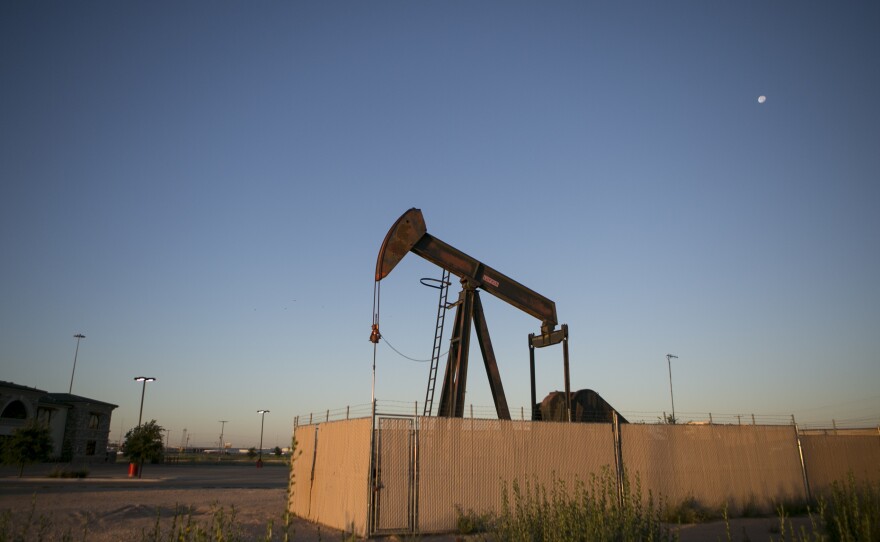 Pump jacks dot the landscape outside Midland, a West Texas oil town.