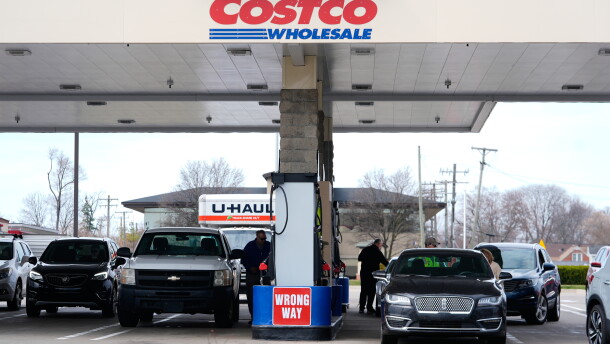 Drivers fuel up at a Costco gas station in Roseville, Mich.