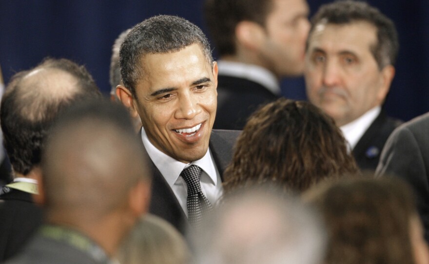 President Obama greets supporters after giving closing remarks Tuesday at a small business forum at Cleveland State University. Obama has only weighed in once on the union protests in Indiana, Ohio and Wisconsin.