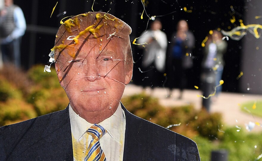 An egg is thrown at a cardboard cutout of Republican presidential candidate Donald Trump during a protest in Burlingame, Calif., last week.
