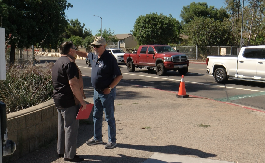 Past President of the San Diego Veterans For Peace is shown talking to KPBS reporter John Carroll outside MCAS Miramar on September 22, 2022.